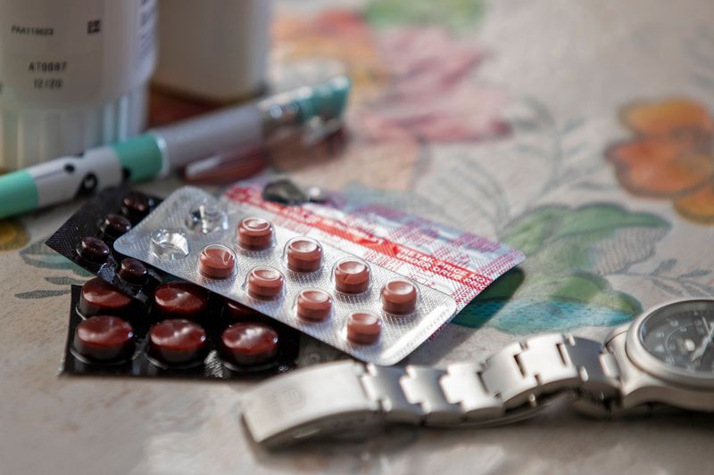 Vitamins and hypertensive medicine lay on the table of anesthesiologist Manuel Sotelo III. 