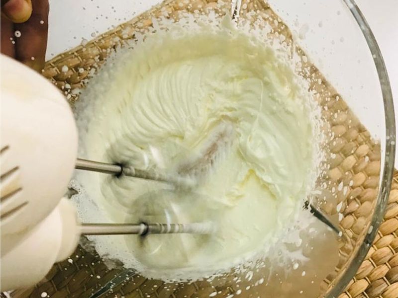 Step 1: Whisk the cream in a bowl till it turns soft and creamy as shown in the picture.