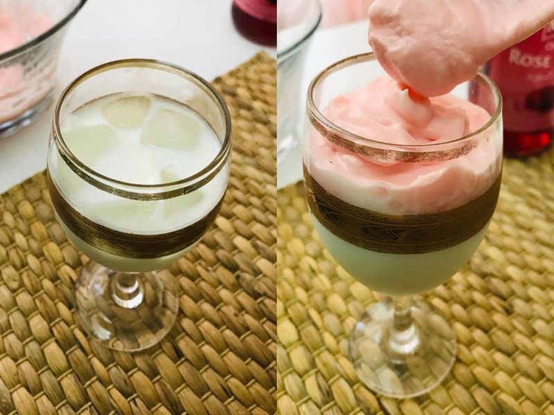 Step 3: Keep aside and in a glass, add four-five ice cubes, fill roughly half of your cup with milk. Top this with the whipped rose cream, and garnish with slightly-ground pistachios or almonds.