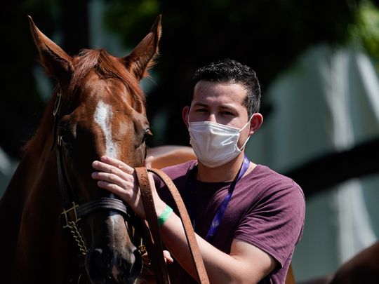Jockeys and handlers are required to wear masks in the UK