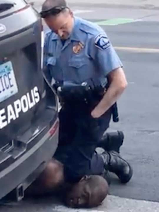 Officers sacked in US after black man dies as policeman kneels on ...