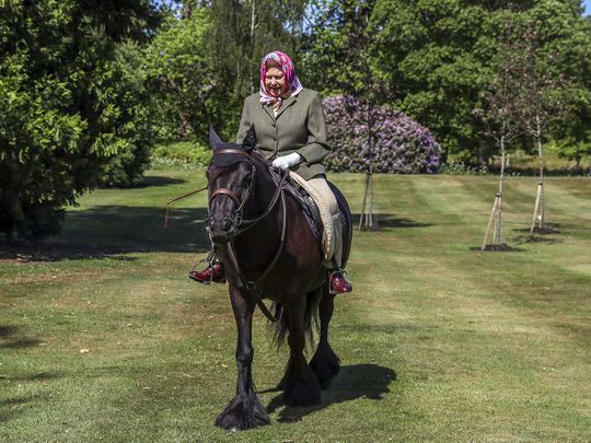 Britain's Queen Elizabeth II rides Balmoral Fern, a 14-year-old Fell pony, in Windsor