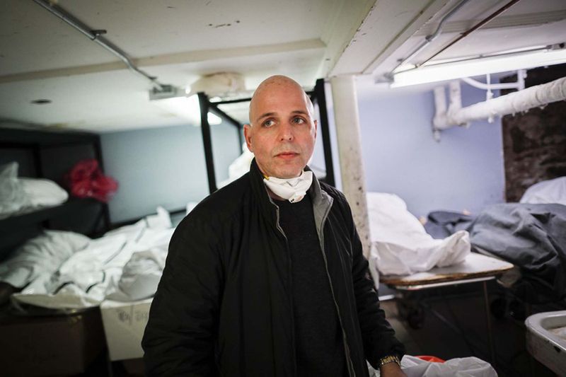 Pat Marmo, owner of Daniel J. Schaefer Funeral Home, walks through his body holding facility that is struggling to handle overflow of clients stemming from COVID-19 deaths, Thursday, April 2, 2020, in the Brooklyn borough of New York.