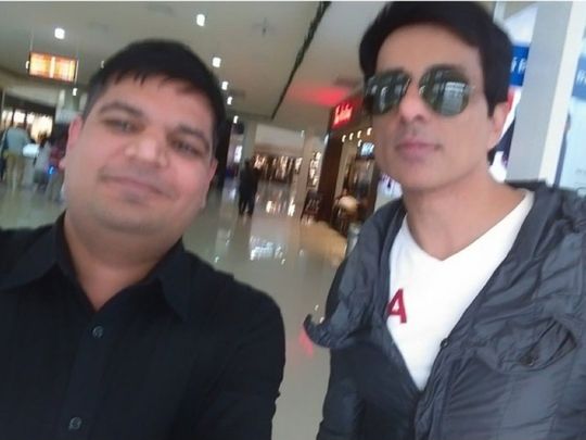 Sonu Sood seen here with a stranded Indian looking for repatriation  