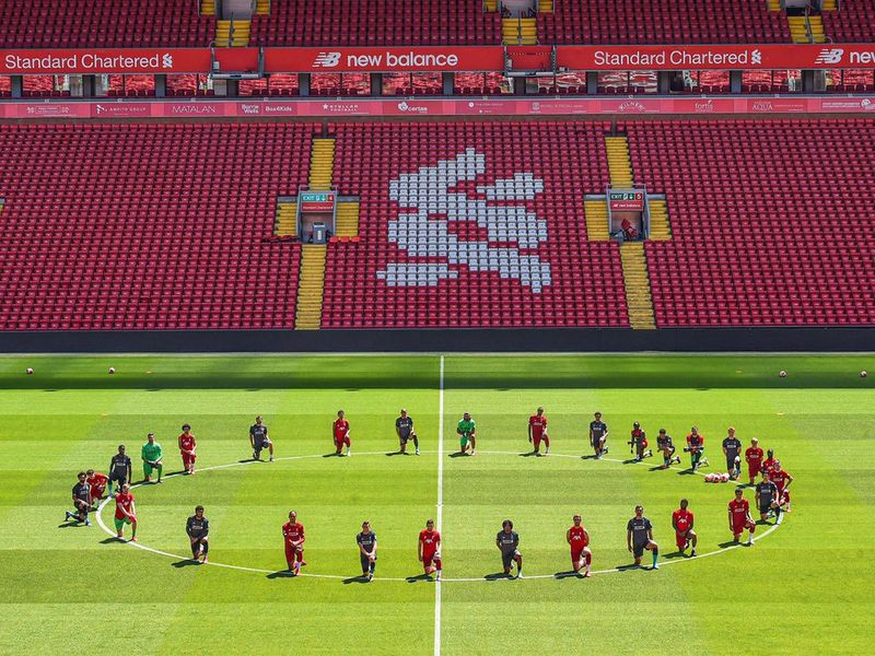Liverpool players take a knee for George Floyd during training at Anfield.
