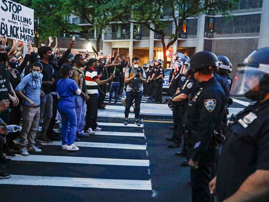 Protesters confront New York Police officers Floyd George