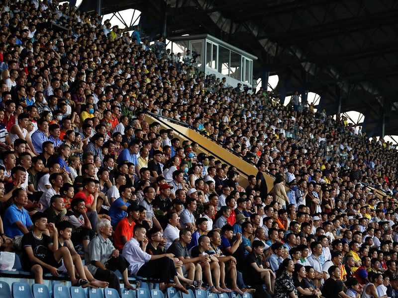 Fans watch a football match in Vietnam