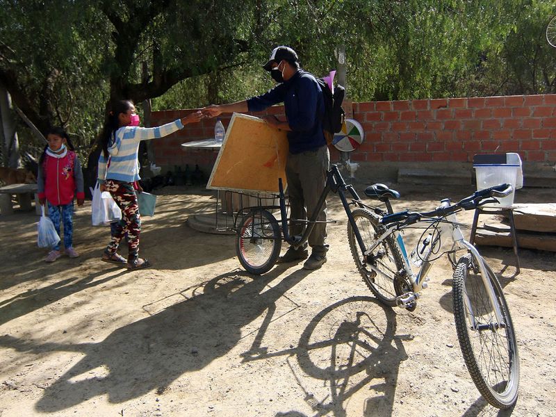 Bolivian teacher on a bike brings school to pupils