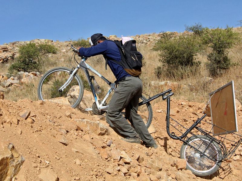 Bolivian teacher on a bike brings school to pupils