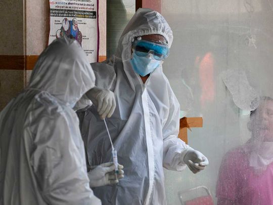 Health officials swab Delhi India coronavirus