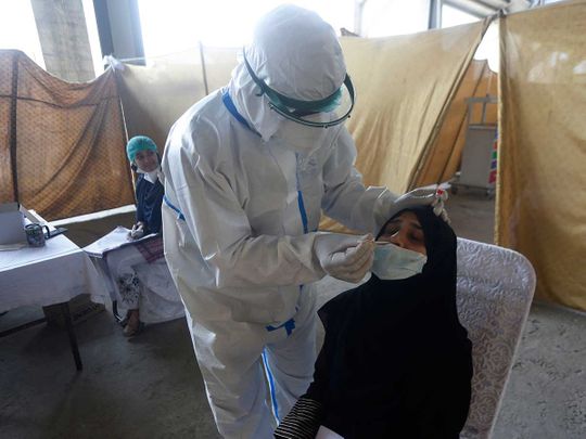 Lahore Pakistan health worker nasal swab