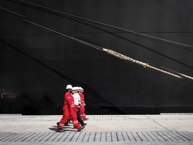 Seafarers walk the docks at Khalifa Port 