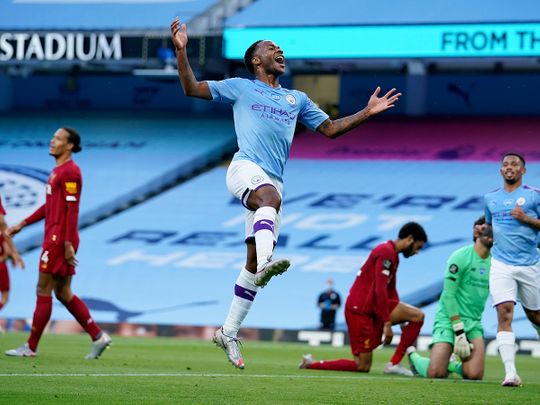 Raheem Sterling celebrates scoring against Liverpool