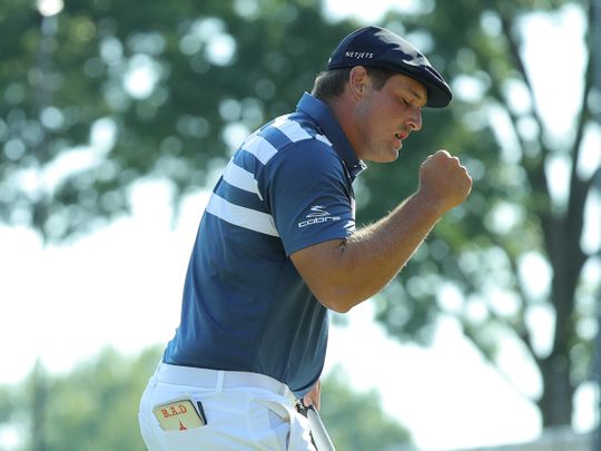 Bryson DeChambeau celebrates his win during the final round of the Rocket Mortgage Classic 