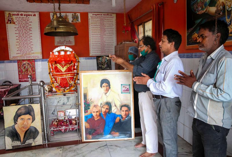 Bhopal: Fans of Bollywood mega star Amitabh Bachchan pray for his speedy recovery from COVID-19, at a temple in Bhopal, Sunday, July 12, 2020.