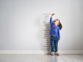 Can short kids grow into tall adults?