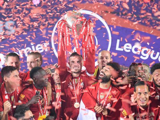 Football: Liverpool players receive English Premier League trophy on ...