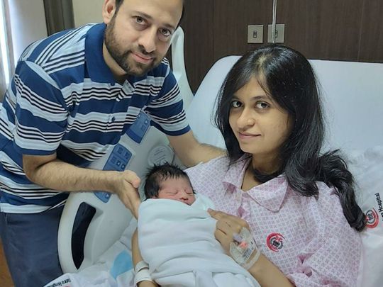NAT 200731 Ambareen Tariq and her baby girl and husband-1596177635822