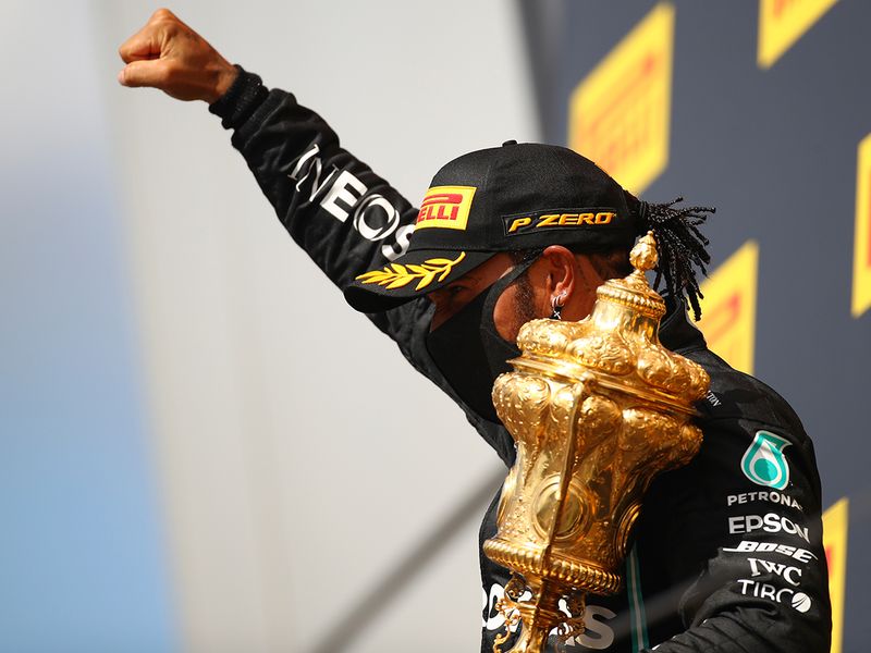 Lewis Hamilton celebrates on the podium at Silverstone.