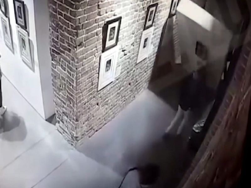Security footage at the Main Avenue Cultural Center in Yekaterinburg, Russia, shows a wall of artwork collapsing