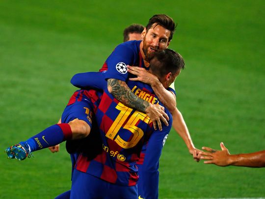 Lionel Messi celebrates his strike against Napoli.