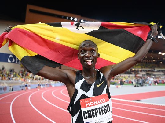 Uganda's Joshua Cheptegei celebrates after breaking the wold record in the men's 5,000m final during the Diamond League athletics meeting in Monaco 
