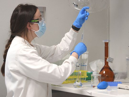 A chemist works at AstraZeneca's Sydney headquarters