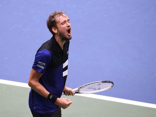 Daniil Medvedev of Russia celebrates winning match point against Andrey Rublev 