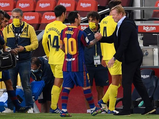 Lionel Messi with Barcelona coach Ronald Koeman