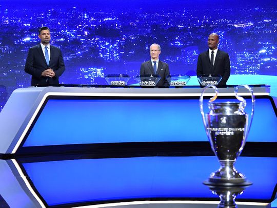 Didier Drogba, Uefa competitions director Giorgio Marchetti and Pedro Pinto conduct the Champions League draw in Geneva