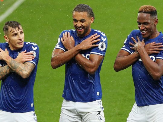 Everton's Yerry Mina celebrates with Lucas Digne and Dominic Calvert-Lewin 