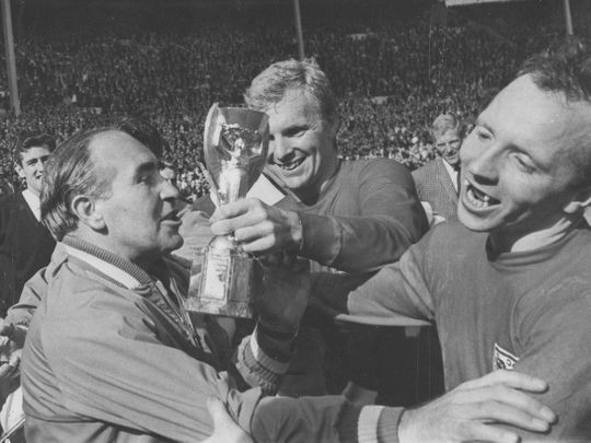 Nobby Stiles, right, celebrates with England captain Bobby Moore after winning the World Cup in 1966.