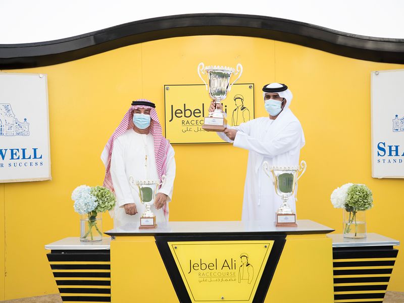 Gabr connections with the Shadwell Condition Stakes trophy at Jebel Ali