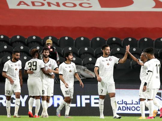 Al Jazira's Ali Mabkhout celebrates his opener against Hatta