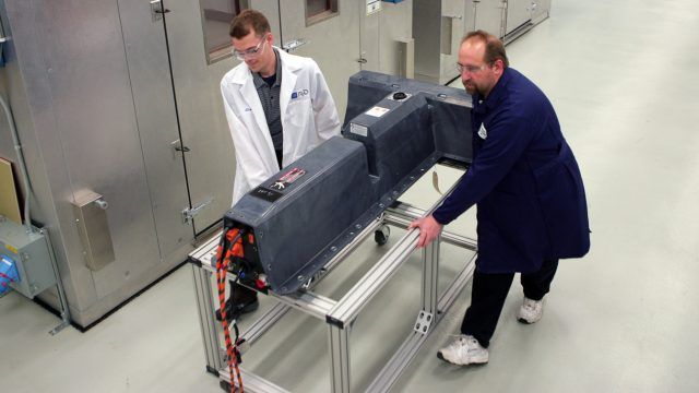 GM engineers with a battery pack for the Chevrolet Volt, circa 2010.
