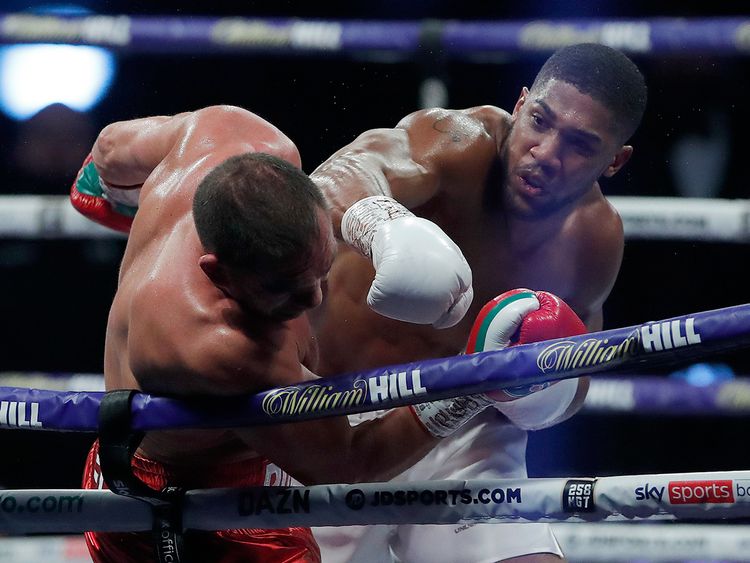 World Heavyweight boxing champion Anthony Joshua lands a blow on Bulgaria's Kubrat Pulev during their heavyweight title fight at Wembley Arena 