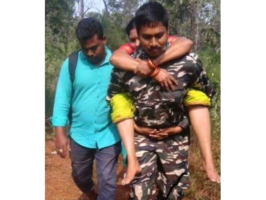 India: Muslim man carries Hindu woman on his shoulder for 6km to save ...