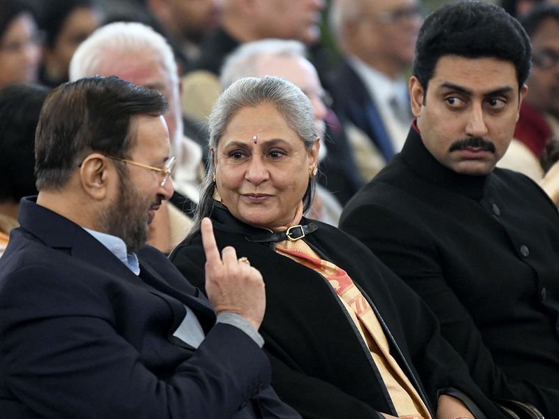 Union Minister of Information and Broadcasting Prakash Javadekar in conversation with Rajya Sabha MP and wife of Amitabh Bachchan, Jaya Bachchan as Abhishek Bachchan looks on during a ceremony to present Dadasaheb Phalke Award to Veteran Actor Amitabh Bachchan at Rashtrapati Bhavan. 