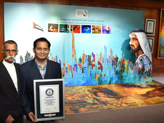 Ramkumar Sarangapani ( right), the Guinness World records holder for the Largest Pop Up Greetings Card with Akbar Saheb ( left), the artist who designed the card.-1609575588966