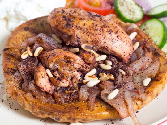 Baked chicken with Arabic bread 