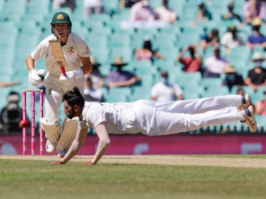 Australia's Marnus Labuschagne plays the ball past Indian bowler Mohammed Siraj during play on day four of the third cricket test between India and Australia at Sydney Cricket Ground