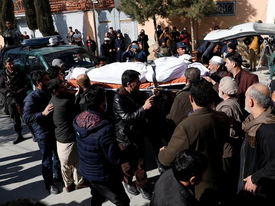 Relatives carry the body of one of the female judges