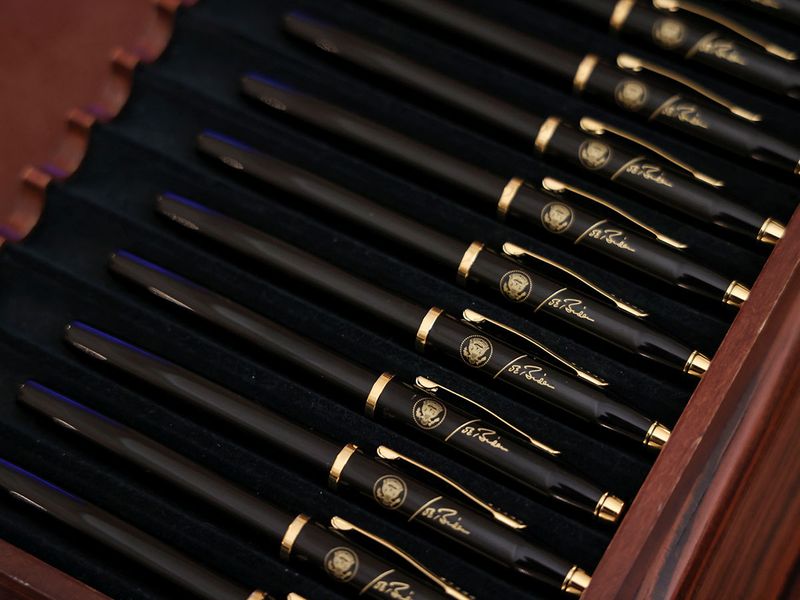 A box of pens with the presidential seal and the signature of Joe Biden is seen on display at the White House in Washington.
