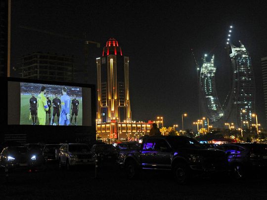 Football supporters watch the Fifa Club World Cup semi-final between Egypt's Al Ahly and Germany's Bayern Munich on a giant screen in Lusail. The event is a warm-up event ahead of the Fifa World Cup next year