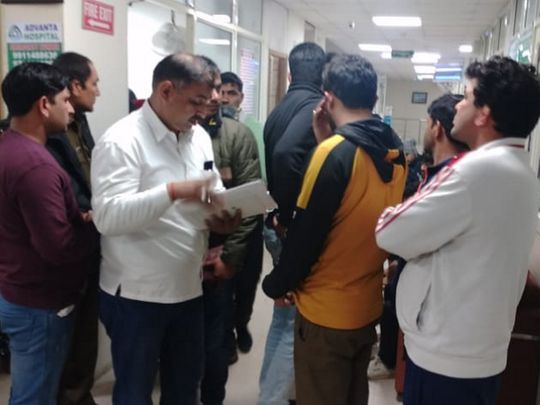 Police officials at a hospital after five people died at Mehar Singh Akhada in a firing incident, in Rohtak. 