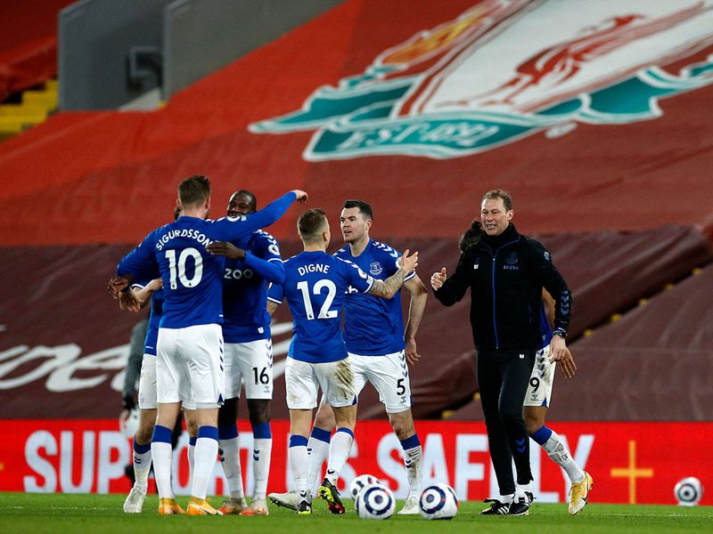 Everton's assistant manager Duncan Ferguson celebrates with his team after the win over Liverpool