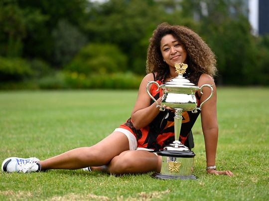 Naomi Osaka poses with her Australian Open trophy on February 21, 2021.
