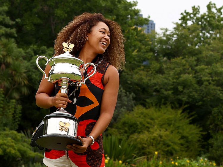 Naomi Osaka poses with her Australian Open trophy on February 21, 2021.