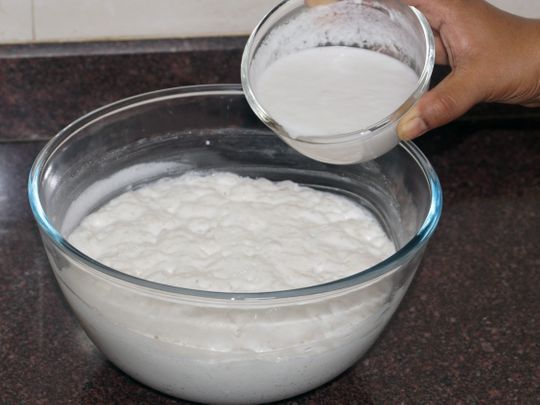Adding coconut paste to the fermented batter