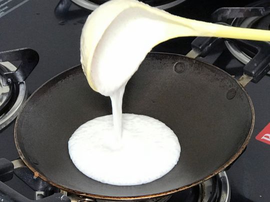 Pour measured serving of batter into the curved pan